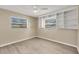 Bright bedroom with built-in shelving and wood-look tile flooring at 1493 Janet Pl, Englewood, FL 34223