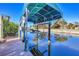 Private boat lift with covered dock and canal access at 1493 Janet Pl, Englewood, FL 34223