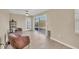 Cozy Gathering room featuring comfortable seating and sliding glass doors to the outdoors at 1493 Janet Pl, Englewood, FL 34223