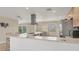 Spacious kitchen featuring modern appliances and an island with barstool seating at 1493 Janet Pl, Englewood, FL 34223