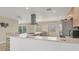 Modern kitchen with a large island and wood cabinets at 1493 Janet Pl, Englewood, FL 34223