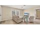 Living room with light colored couch and wood-look flooring at 1493 Janet Pl, Englewood, FL 34223