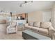 Bright living room with contemporary furnishings open to the kitchen and dining area at 1493 Janet Pl, Englewood, FL 34223