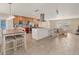 Open-concept living space with a dining area, modern kitchen, and cozy living room at 1493 Janet Pl, Englewood, FL 34223