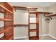 Spacious walk-in closet with ample shelving and hanging space at 1493 Janet Pl, Englewood, FL 34223