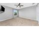 Spacious bedroom with carpeting and large window at 15064 Hennipen Cir, Port Charlotte, FL 33981