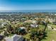 Aerial view showing a single-story house on a large lot near the water at 1770 Hudson St, Englewood, FL 34223