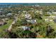 Aerial view of property showcasing a house nestled among lush greenery at 1770 Hudson St, Englewood, FL 34223