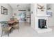 Small dining area with a round table and chairs near a fireplace at 1770 Hudson St, Englewood, FL 34223