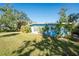 Light blue single story home with a large grassy yard at 1770 Hudson St, Englewood, FL 34223