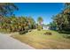 Side view of a light blue ranch style home at 1770 Hudson St, Englewood, FL 34223