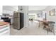 Kitchen boasts stainless steel appliances and opens to a dining area at 1770 Hudson St, Englewood, FL 34223