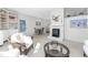 Living room with fireplace, built-in shelving, and comfortable seating at 1770 Hudson St, Englewood, FL 34223