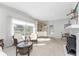 Spacious living area with large windows and a cozy fireplace at 1770 Hudson St, Englewood, FL 34223