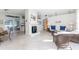 Living room features a fireplace, comfortable seating and adjacent dining area at 1770 Hudson St, Englewood, FL 34223