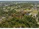 Large parcel ready for building surrounded by trees and lush landscaping at 1828 Whispering Pines Cir, Englewood, FL 34223