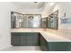 Spacious bathroom with a long vanity, large mirrors, and neutral tiling at 1828 Whispering Pines Cir, Englewood, FL 34223