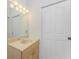 Bathroom featuring vanity with a mirror and ample storage space at 1828 Whispering Pines Cir, Englewood, FL 34223