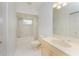 Well-lit bathroom features a shower-tub combo, and vanity at 1828 Whispering Pines Cir, Englewood, FL 34223