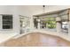 Breakfast nook features a window with a view to the garden and glass paneled doors at 1828 Whispering Pines Cir, Englewood, FL 34223