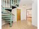 Entryway featuring spiral staircase, tiled floors and natural lighting at 1828 Whispering Pines Cir, Englewood, FL 34223