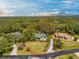 Charming single-Gathering home surrounded by trees and mature landscaping at 1828 Whispering Pines Cir, Englewood, FL 34223
