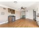 Bright room with hardwood floors, wet bar and light from sliding glass doors at 1828 Whispering Pines Cir, Englewood, FL 34223