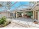 Back porch with access to the house, yard, and outdoor features at 1828 Whispering Pines Cir, Englewood, FL 34223