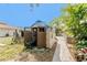 View of backyard shed, tools and equipment at 1828 Whispering Pines Cir, Englewood, FL 34223