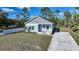 Single-story home with gray siding and small porch at 18302 Gypsy Ave, Port Charlotte, FL 33954