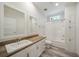 Clean bathroom with white vanity, wood countertop, and a bathtub at 18302 Gypsy Ave, Port Charlotte, FL 33954