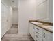 Modern bathroom with double vanity and wood-look floors at 18302 Gypsy Ave, Port Charlotte, FL 33954
