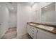 Bathroom boasts double vanity and wood-look floors at 18302 Gypsy Ave, Port Charlotte, FL 33954