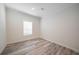 Bright bedroom with wood-look floors and window blinds at 18302 Gypsy Ave, Port Charlotte, FL 33954