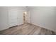 Simple bedroom with light walls and wood flooring at 18302 Gypsy Ave, Port Charlotte, FL 33954