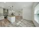 Open concept kitchen and living area with light wood flooring at 18302 Gypsy Ave, Port Charlotte, FL 33954