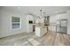 Modern kitchen with white cabinets, wood countertops, and stainless steel appliances at 18302 Gypsy Ave, Port Charlotte, FL 33954
