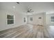 Bright and airy living room with hardwood floors and lots of natural light at 18302 Gypsy Ave, Port Charlotte, FL 33954