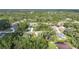 Aerial view of a residential neighborhood with houses nestled among the trees at 18399 Fremont Ave, Port Charlotte, FL 33954