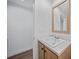 Simple bathroom with a single vanity and access to another room at 18399 Fremont Ave, Port Charlotte, FL 33954
