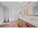 Modern bathroom with double vanity, large mirror, and walk-in shower at 18399 Fremont Ave, Port Charlotte, FL 33954