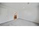 Spacious bedroom with grey carpet and bathroom access at 18399 Fremont Ave, Port Charlotte, FL 33954