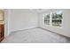 Bedroom with grey carpet and an ensuite bathroom at 18399 Fremont Ave, Port Charlotte, FL 33954