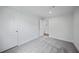 Spacious bedroom with grey carpet and double door closet at 18399 Fremont Ave, Port Charlotte, FL 33954