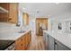 Modern kitchen with gray island and wood cabinets at 18399 Fremont Ave, Port Charlotte, FL 33954