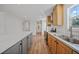 Open concept kitchen with wood cabinets and island at 18399 Fremont Ave, Port Charlotte, FL 33954