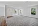 Spacious living room with gray carpet and hardwood floors at 18399 Fremont Ave, Port Charlotte, FL 33954