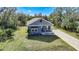 Aerial view of a house with gray siding and driveway at 19095 Willard Ave, Port Charlotte, FL 33954