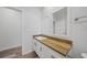 Modern bathroom with white cabinets and a wood countertop at 19095 Willard Ave, Port Charlotte, FL 33954
