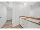 Double vanity bathroom with wood countertop and modern fixtures at 19095 Willard Ave, Port Charlotte, FL 33954